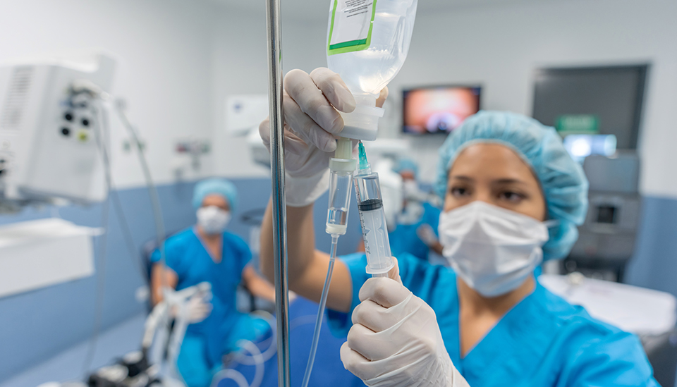 Intravenous medications being administered in a hospital room